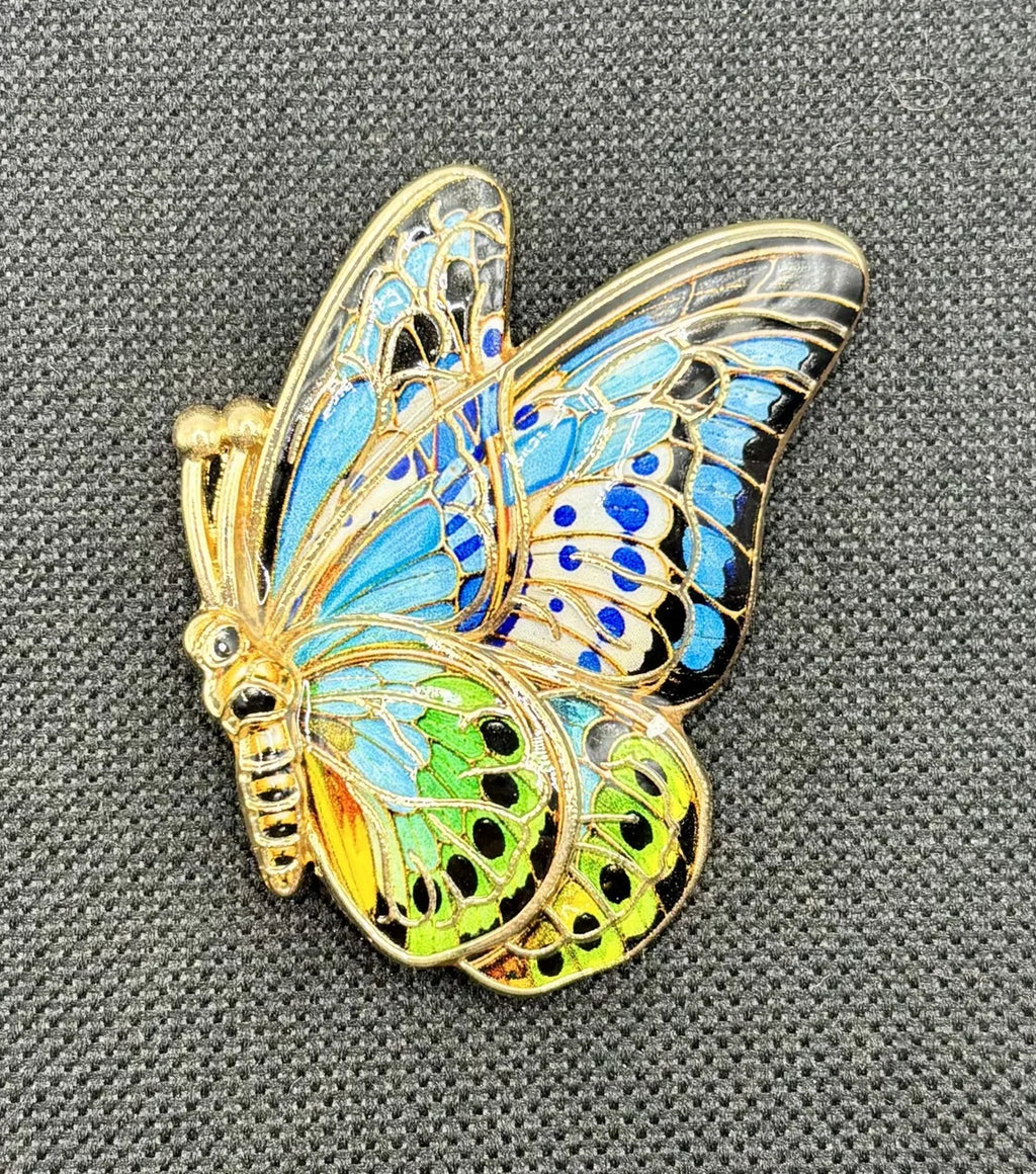 Butterfly needle minder on dark fabric