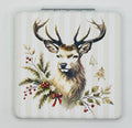 Closed Winter Deer bead case with a deer with antlers, evergreen branches, red berries, and a ribbon