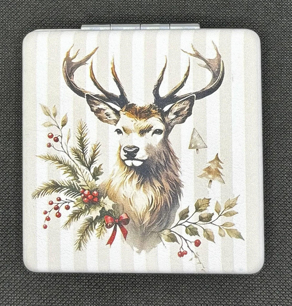 Closed Winter Deer bead case on dark fabric