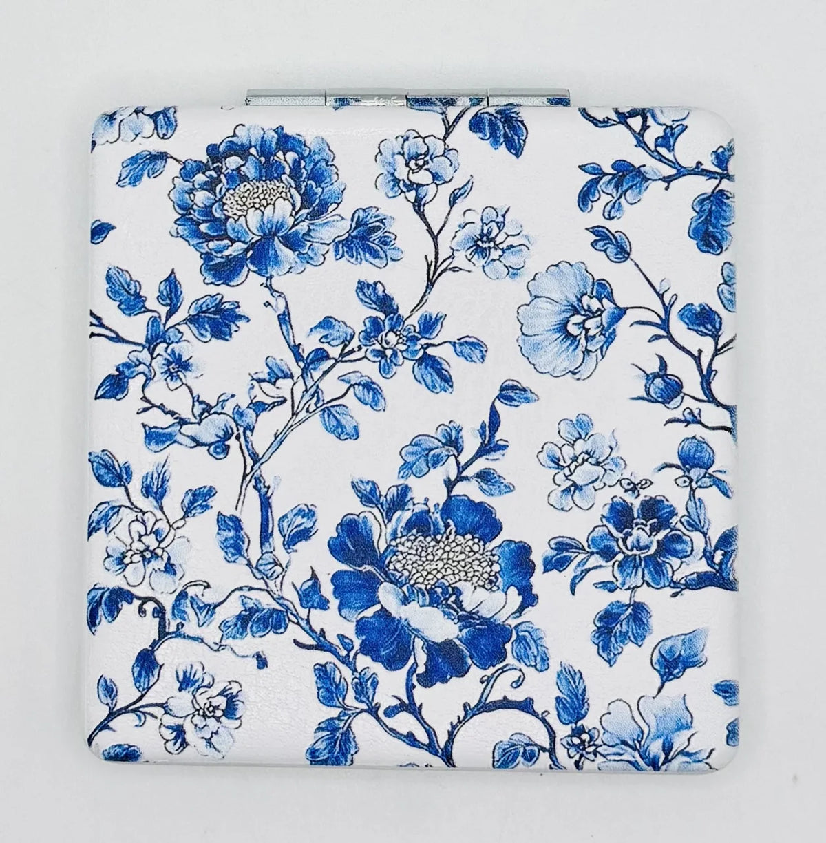 Closed Blue Vine Flowers on White bead case with blue floral vines on a white background