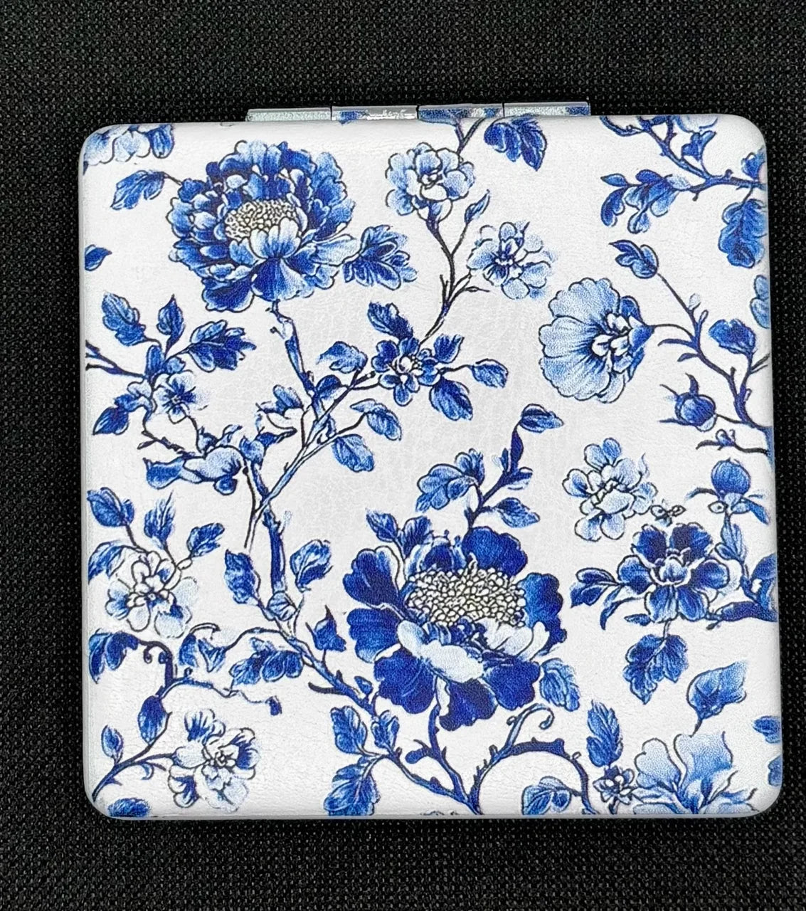 Closed Blue Vine Flowers on White bead case on dark fabric