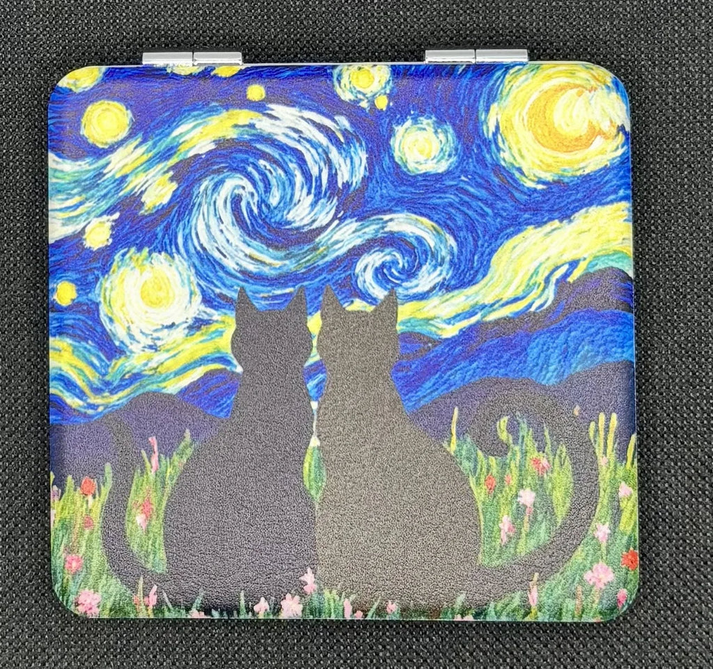 Closed bead case on dark fabric showing the two cats design