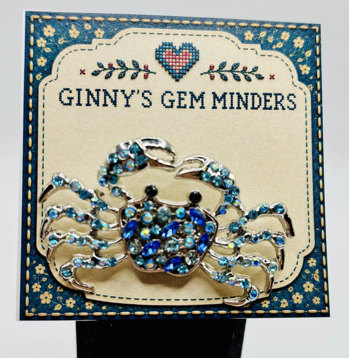 Crystal blue crab needle minder on Ginny’s Gem Minders display card