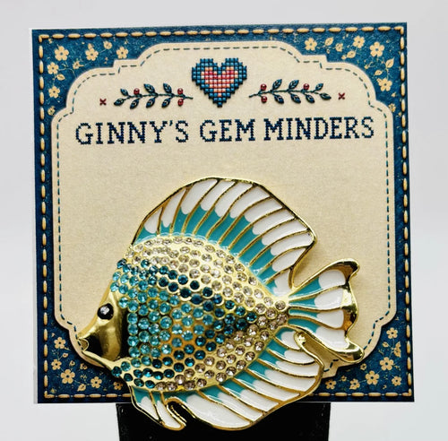 Blue and white crystal discus fish needle minder on Ginny’s Gem Minders display card