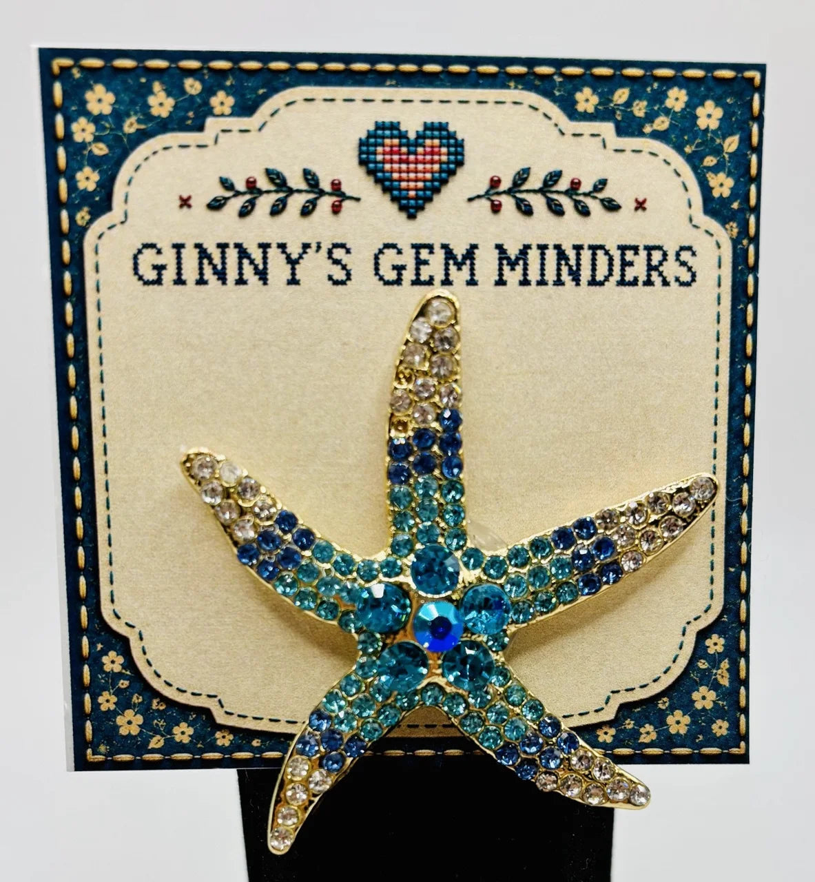 Blue crystal starfish needle minder on Ginny’s Gem Minders display card