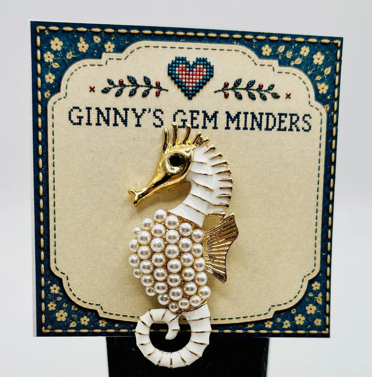 Gold and pearl seahorse needle minder on Ginny’s Gem Minders display card