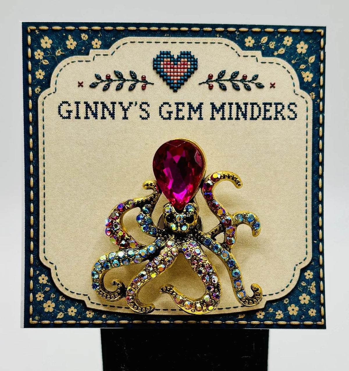 Pink crystal octopus needle minder on Ginny’s Gem Minders display card