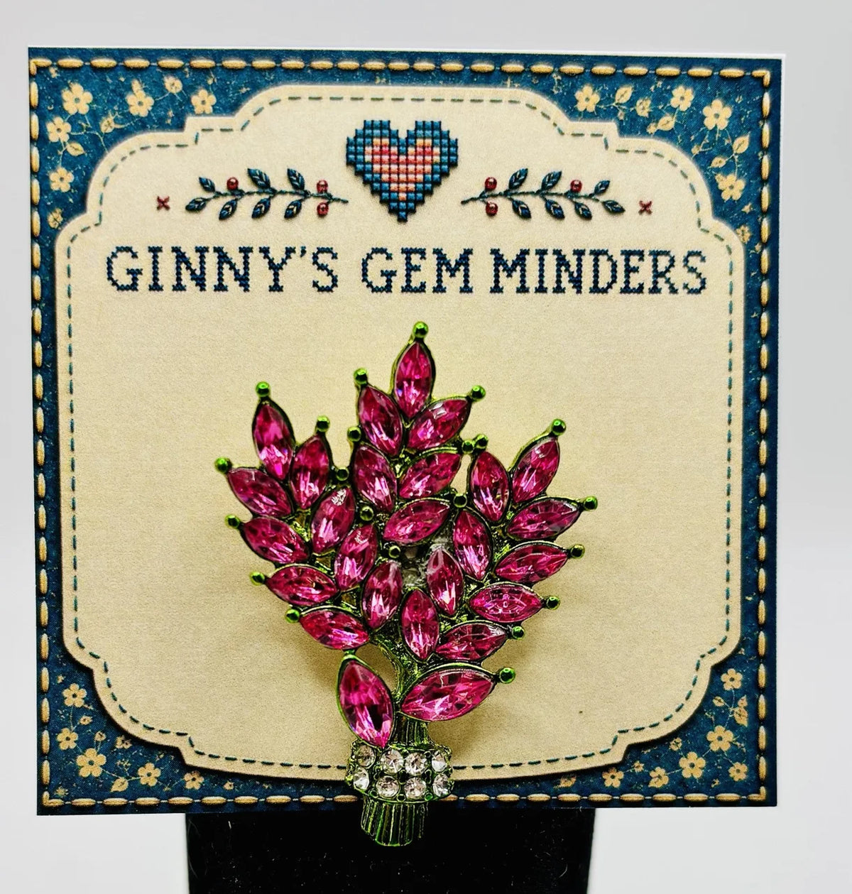 Pink crystal tall flowers needle minder on Ginny’s Gem Minders display card