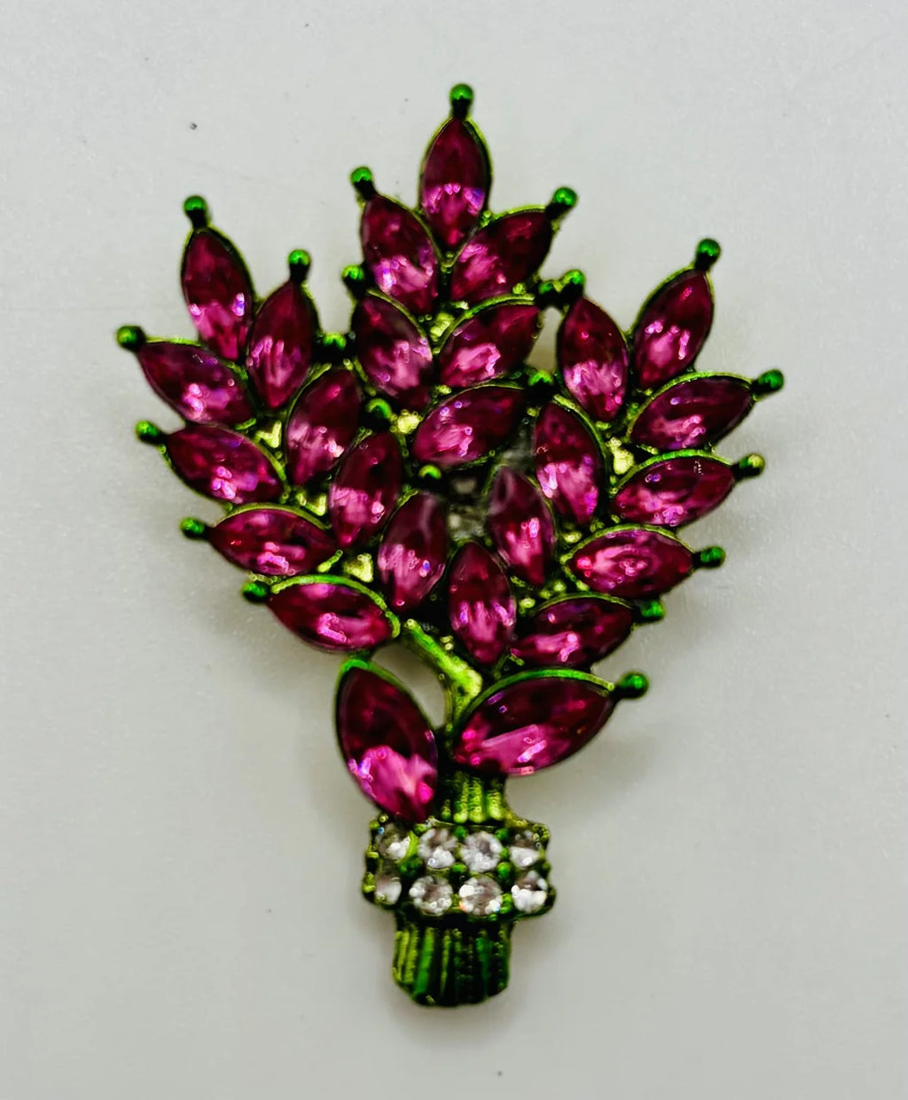 Pink crystal tall flowers needle minder on a white background