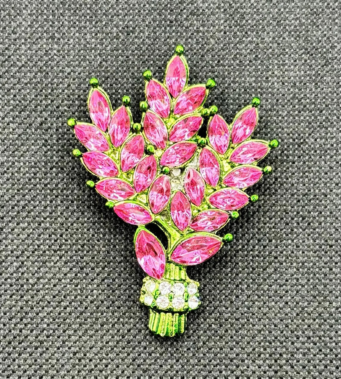 Pink crystal tall flowers needle minder on dark fabric