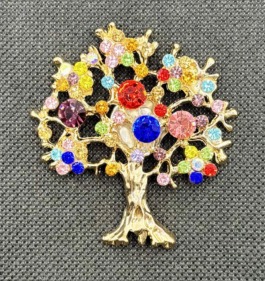 Colorful tree of life needle minder on dark fabric
