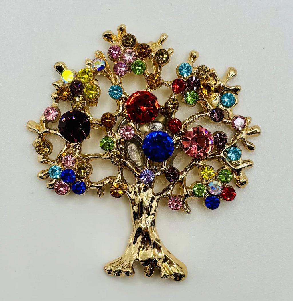 Colorful tree of life needle minder on a white background
