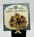 Colorful tree of life needle minder on Ginny’s Gem Minders display card