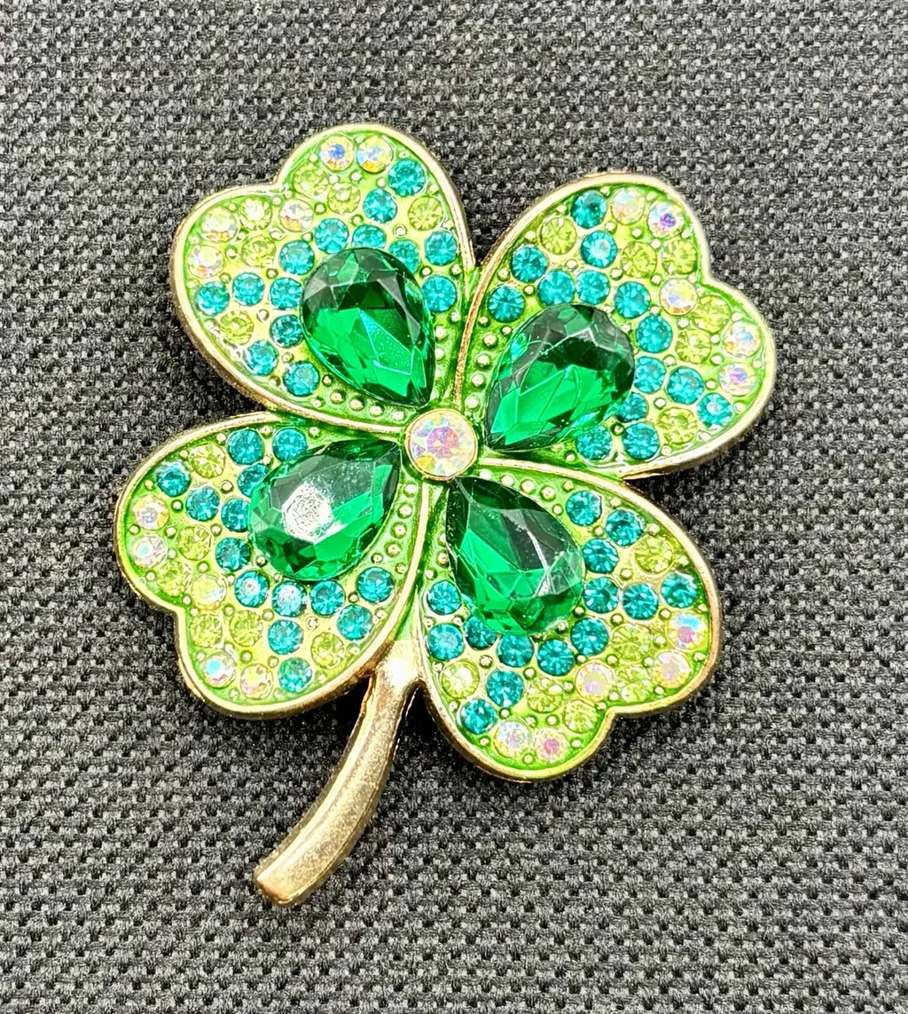 Large crystal shamrock needle minder on dark fabric