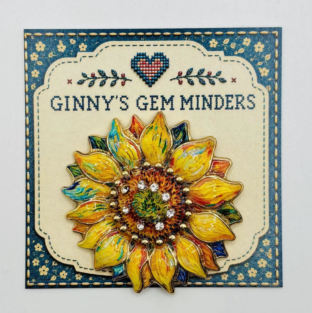 Oil dripped sunflower with crystal needle minder on Ginny’s Gem Minders display card