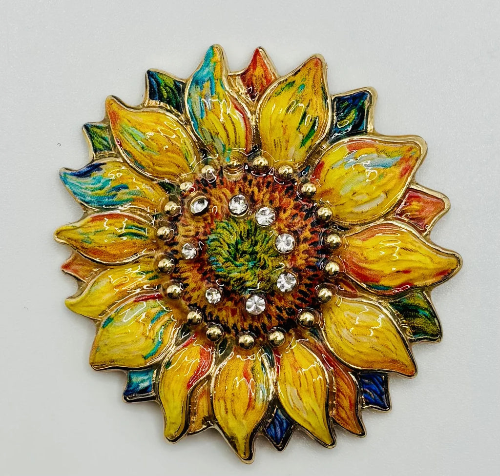 Oil dripped sunflower with crystal needle minder on a white background