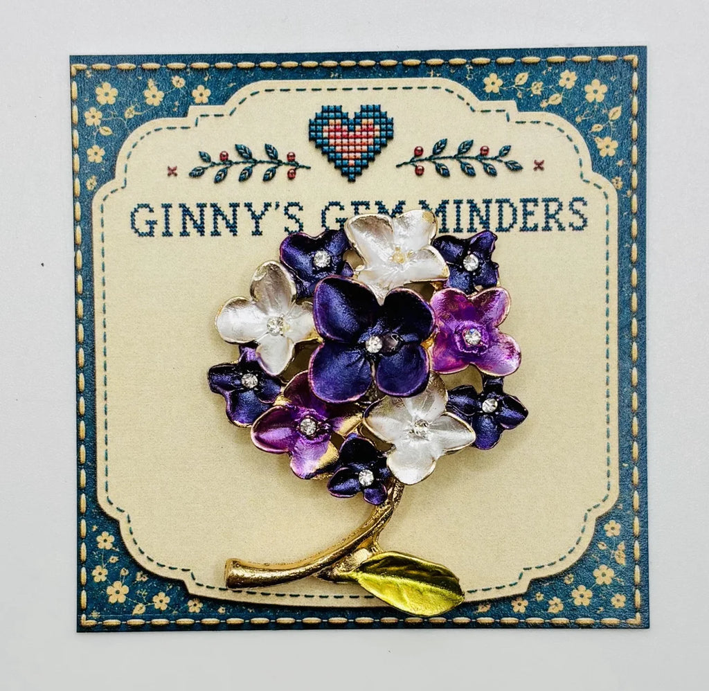 Purple enamel hydrangea needle minder on Ginny’s Gem Minders display card