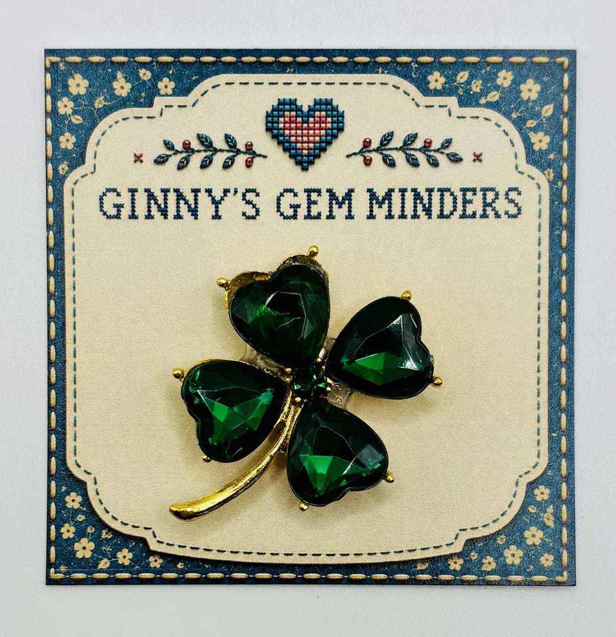 Small crystal shamrock needle minder on Ginny’s Gem Minders display card