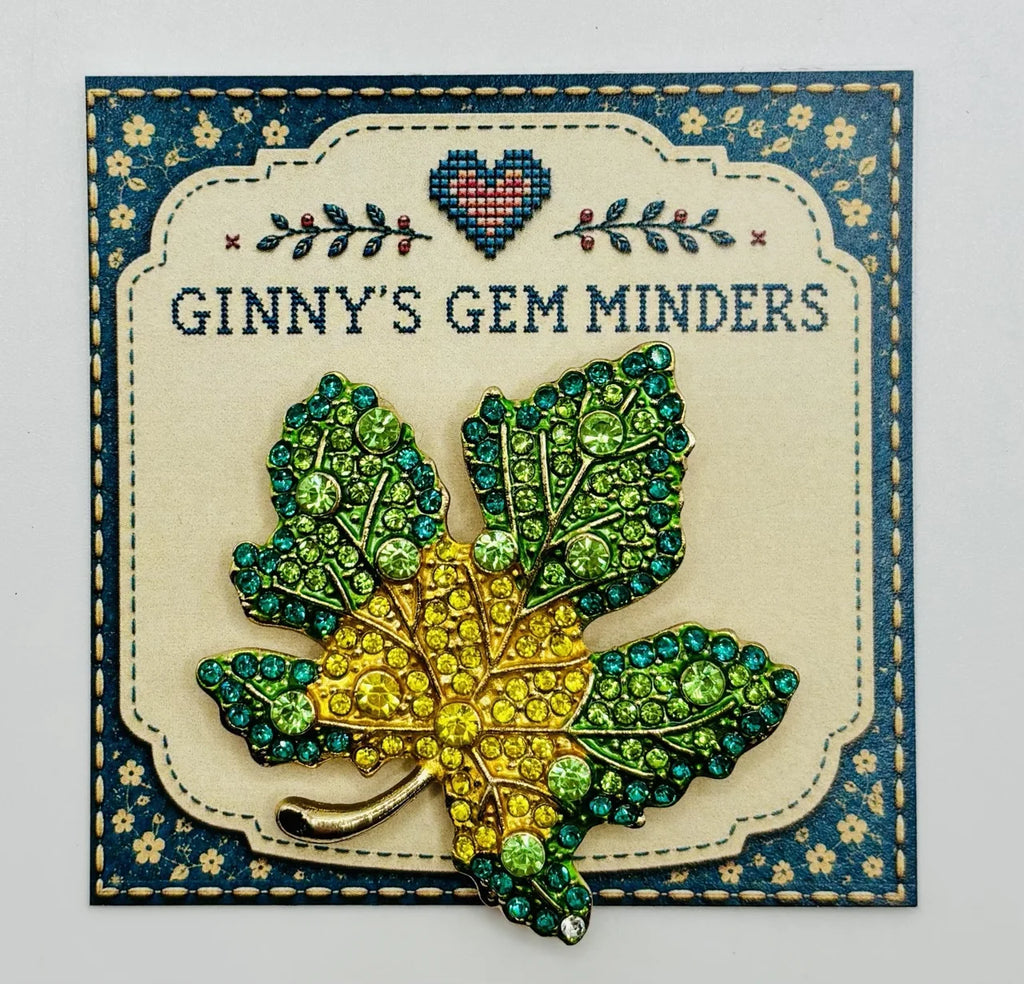 Green and yellow crystal leaf needle minder on Ginny’s Gem Minders display card