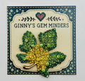 Green and yellow crystal leaf needle minder on Ginny’s Gem Minders display card