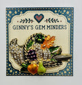 Enamel and crystal cornucopia needle minder on Ginny’s Gem Minders display card