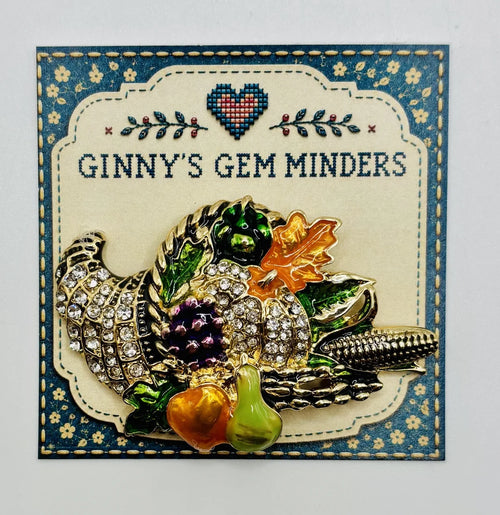 Enamel and crystal cornucopia needle minder on Ginny’s Gem Minders display card