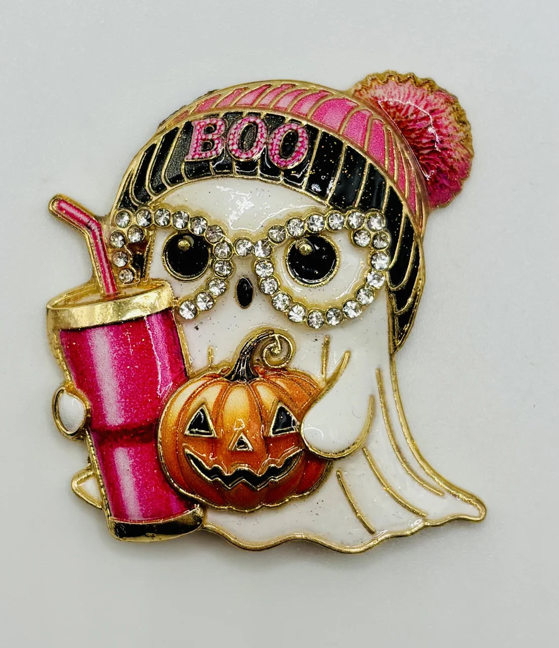 Enamel and crystal ghost girl needle minder on a white background