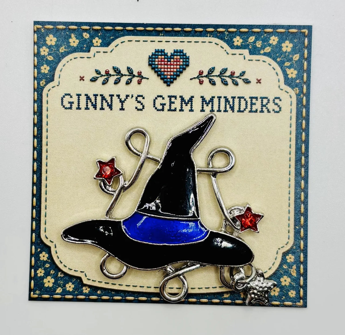 Enamel witch hat with dangling crystals needle minder on Ginny’s Gem Minders display card