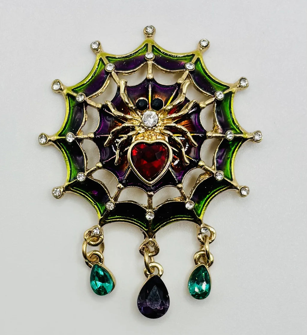 Jeweled spider in web needle minder on a white background