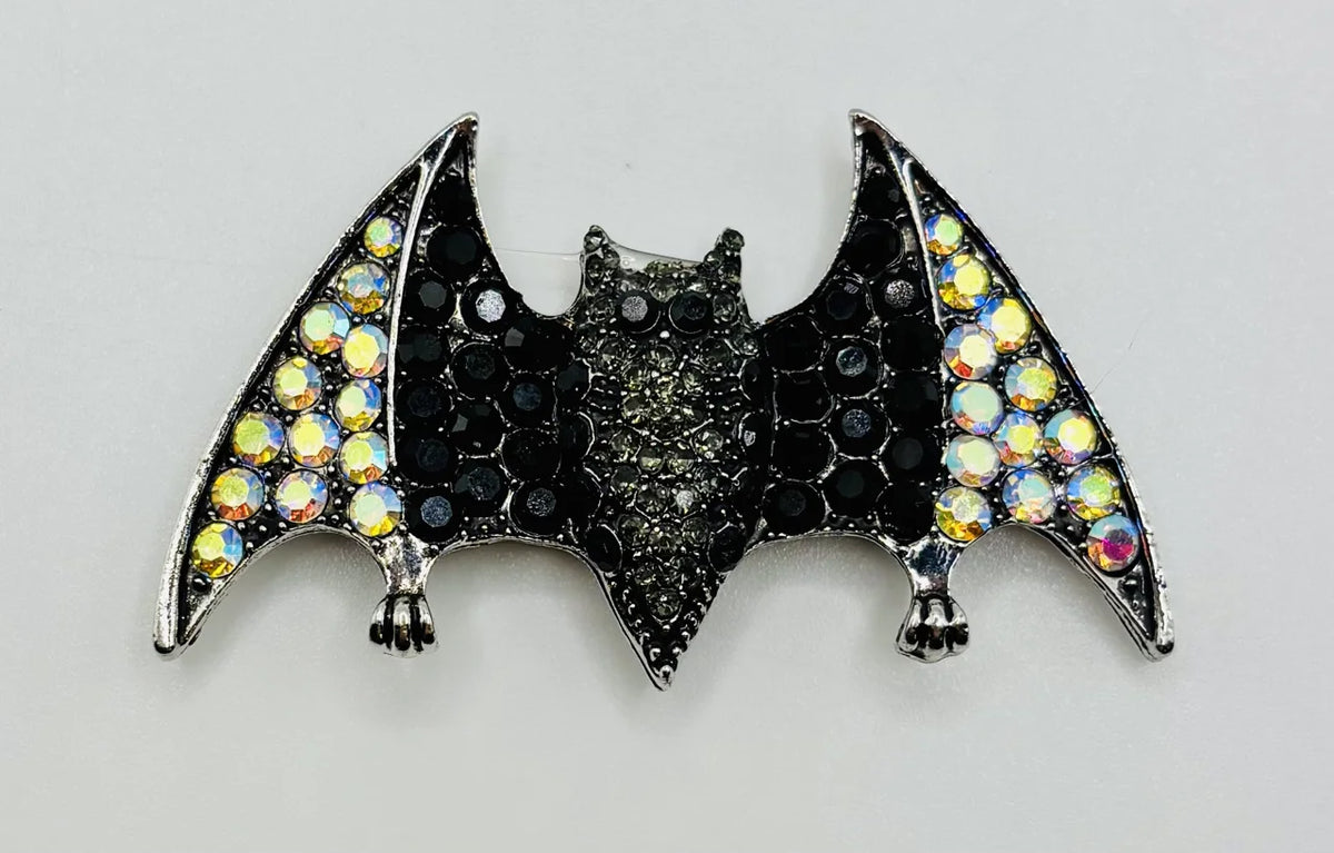 Crystal bat needle minder on a white background
