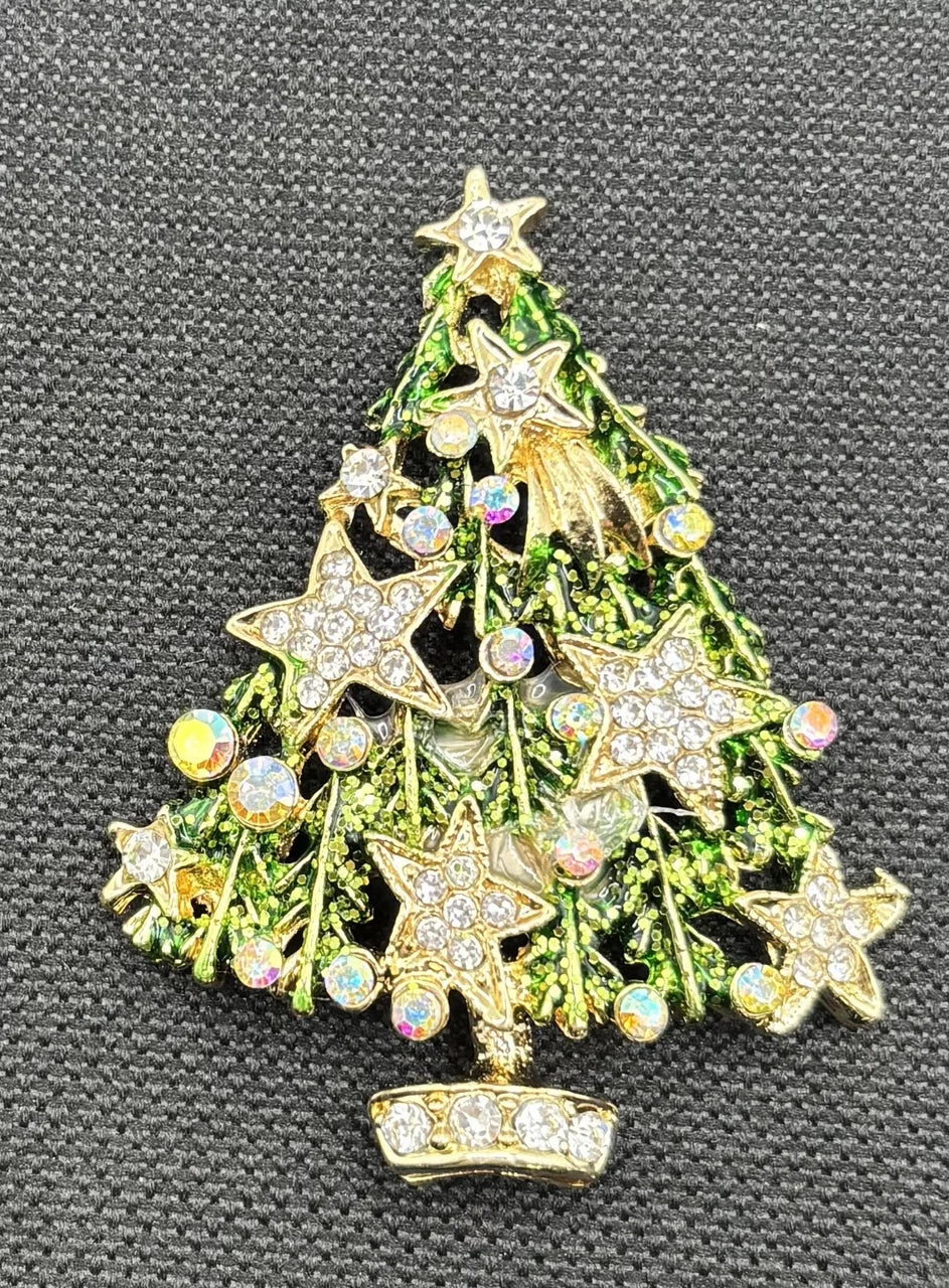 Green tree with crystal stars needle minder on dark fabric