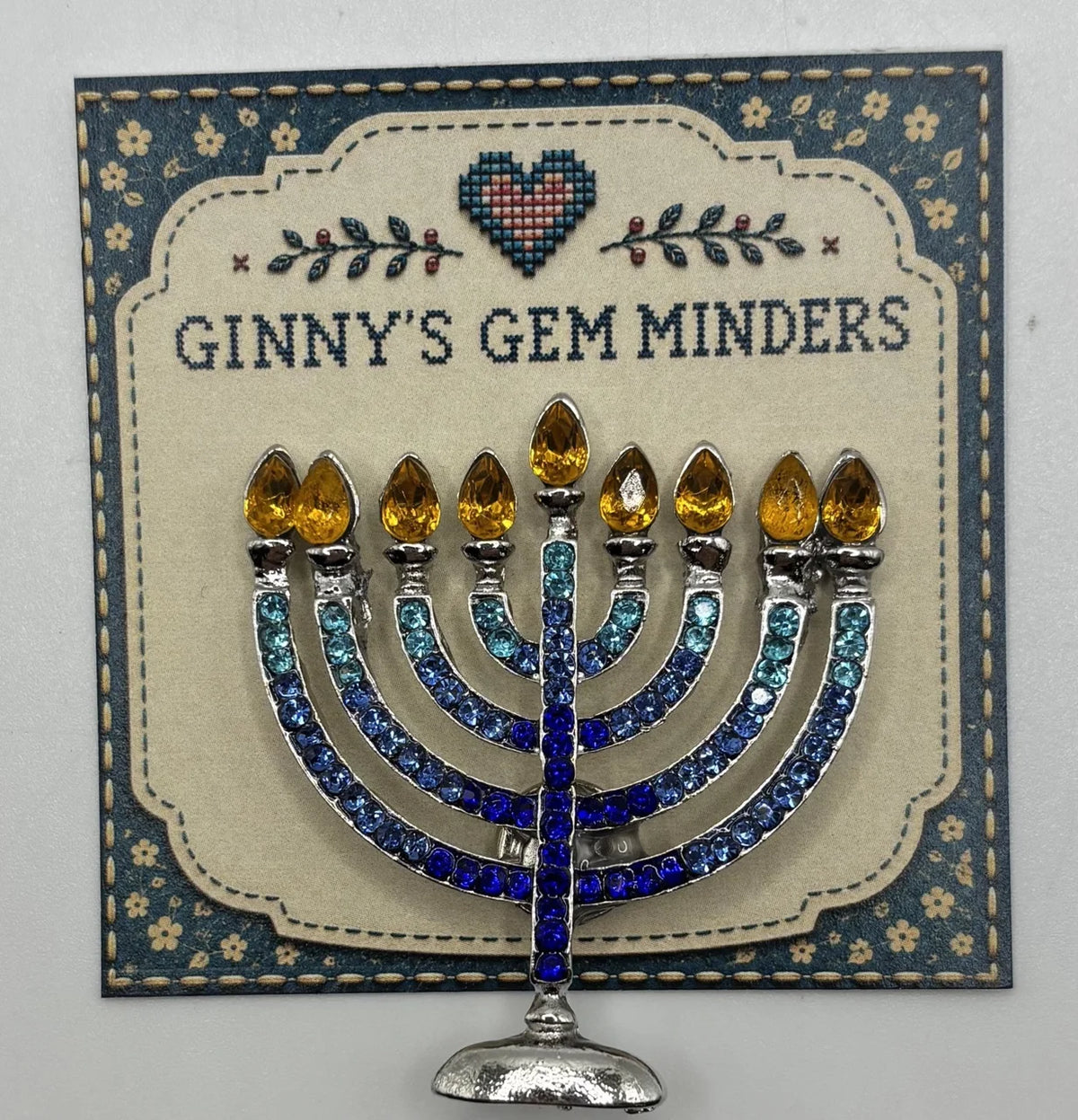 Crystal menorah needle minder on Ginny’s Gem Minders display card