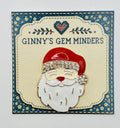 Enamel Santa face needle minder on Ginny’s Gem Minders display card