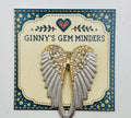 White enamel and crystal angel wings needle minder on Ginny’s Gem Minders display card