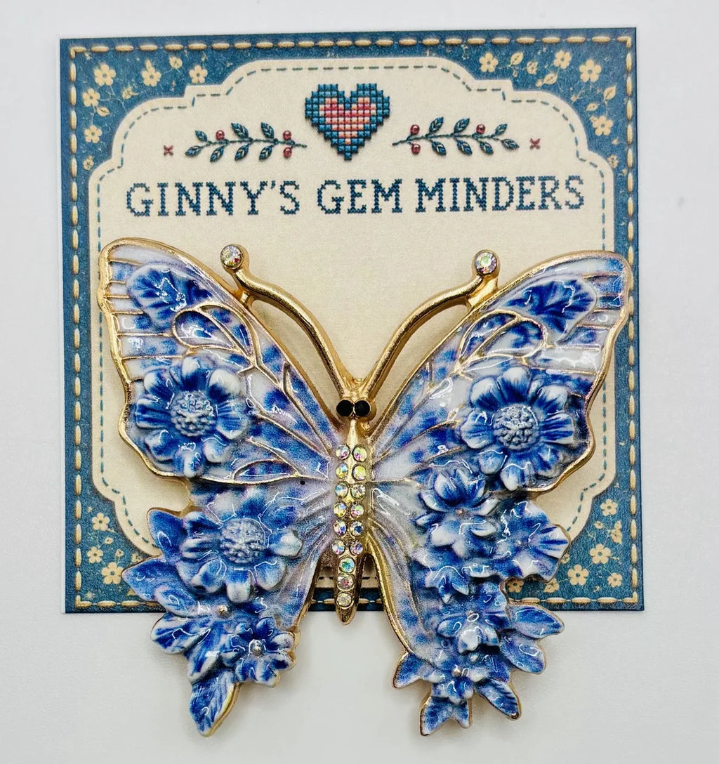 Blue enamel butterfly needle minder on Ginny’s Gem Minders display card