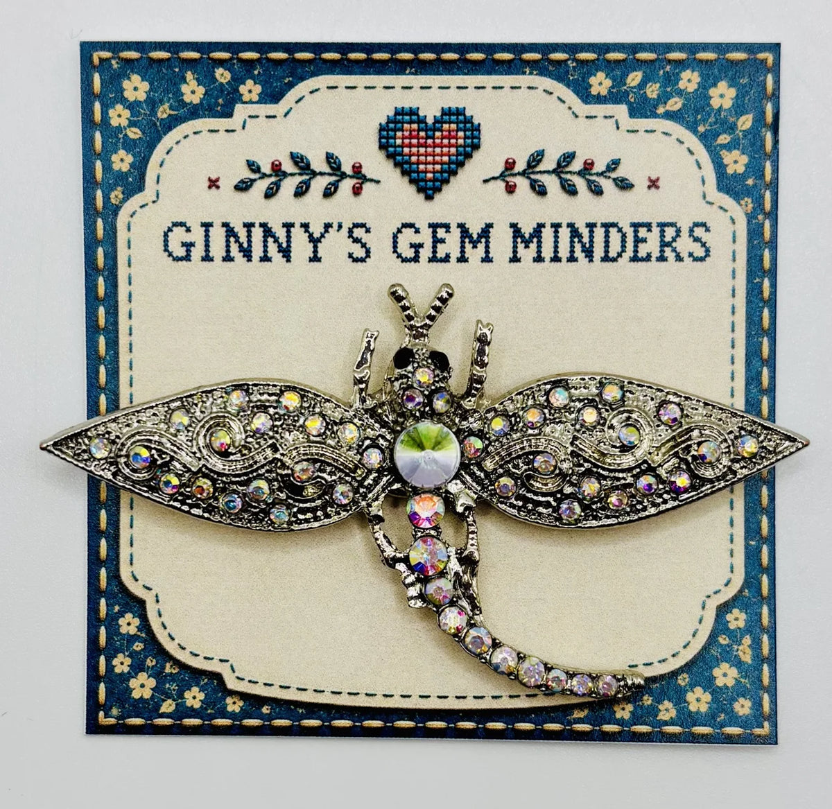 Silver and crystal dragonfly needle minder on Ginny’s Gem Minders display card