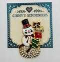 Crystal snowman with gifts needle minder on Ginny’s Gem Minders display card