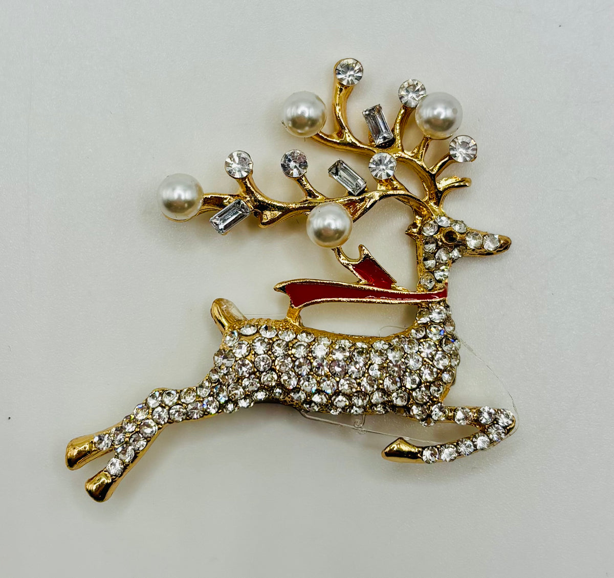 Lovely Crystal and Pearl Reindeer Needle Minder on white background