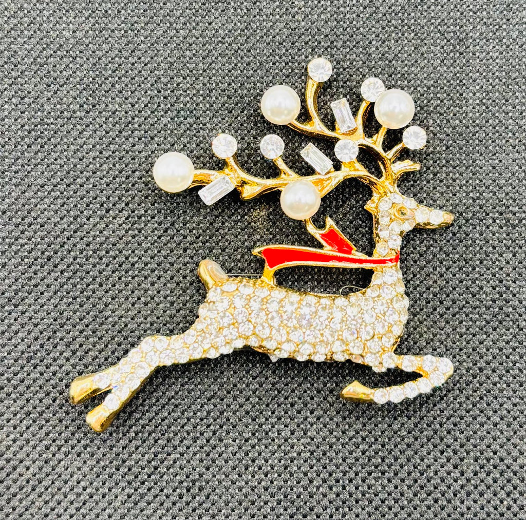 Lovely Crystal and Pearl Reindeer Needle Minder on dark fabric