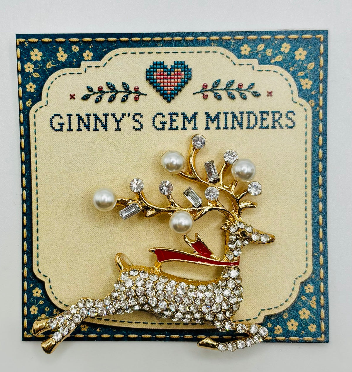 Lovely Crystal and Pearl Reindeer Needle Minder on display card