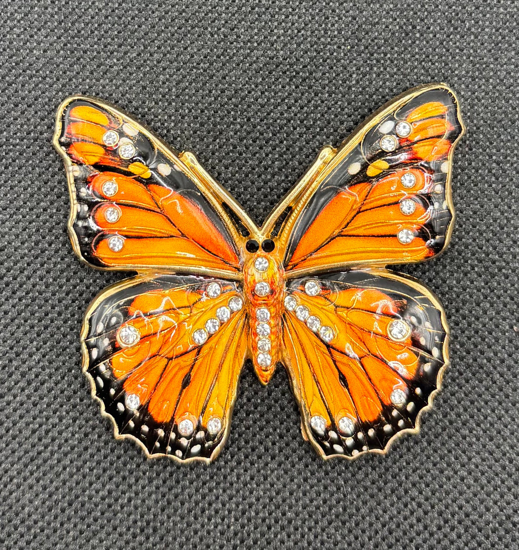 Beautiful Black/Orange Monarch Butterfly Needle Minder on dark fabric