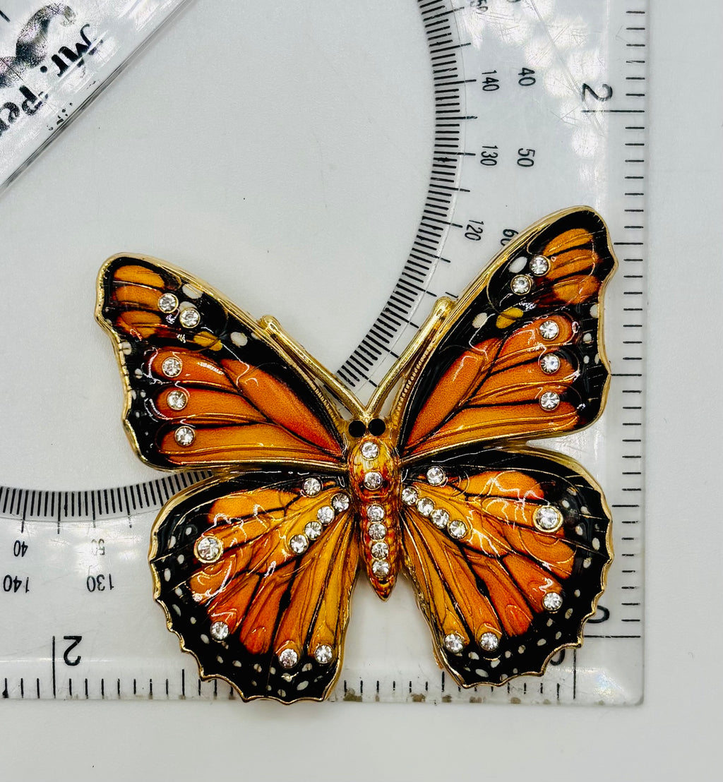 Beautiful Black/Orange Monarch Butterfly Needle Minder beside a ruler for scale
