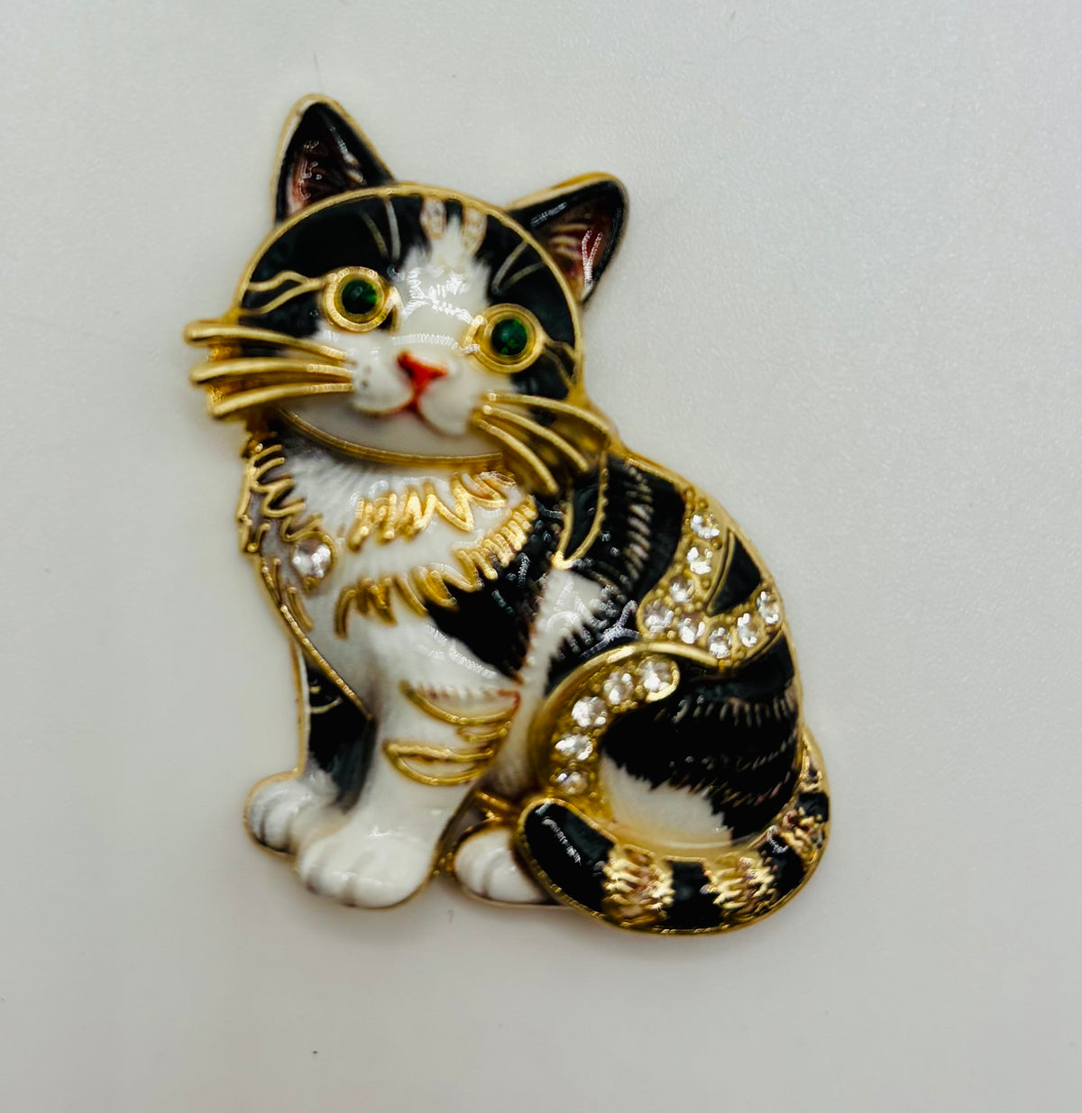 Black and white cat kitty needle minder on white background