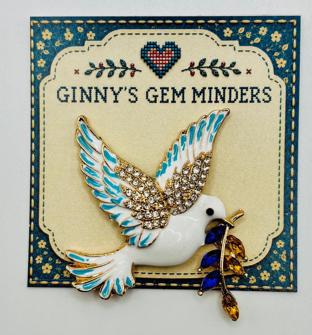 Blue-branch enamel dove needle minder — display card