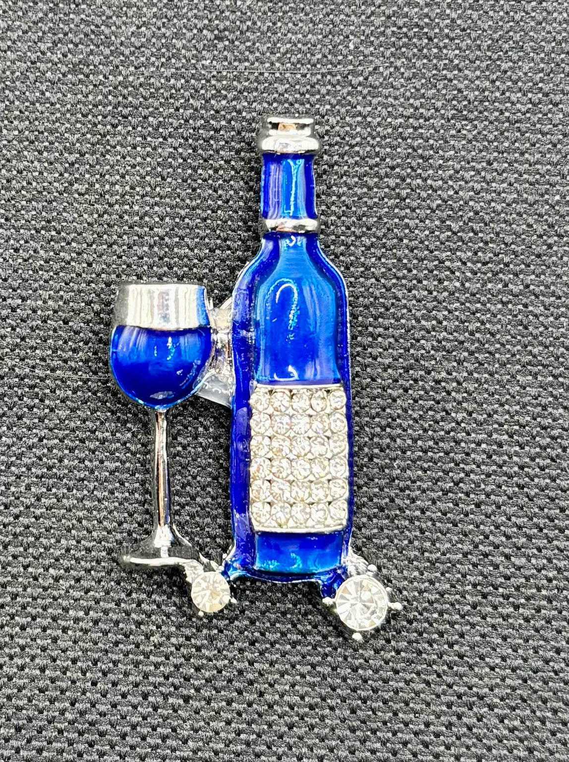 Small Blue Enamel Wine Bottle and Glass Needle Minder — dark fabric