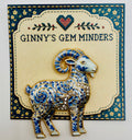 Blue white ram needle minder on display card