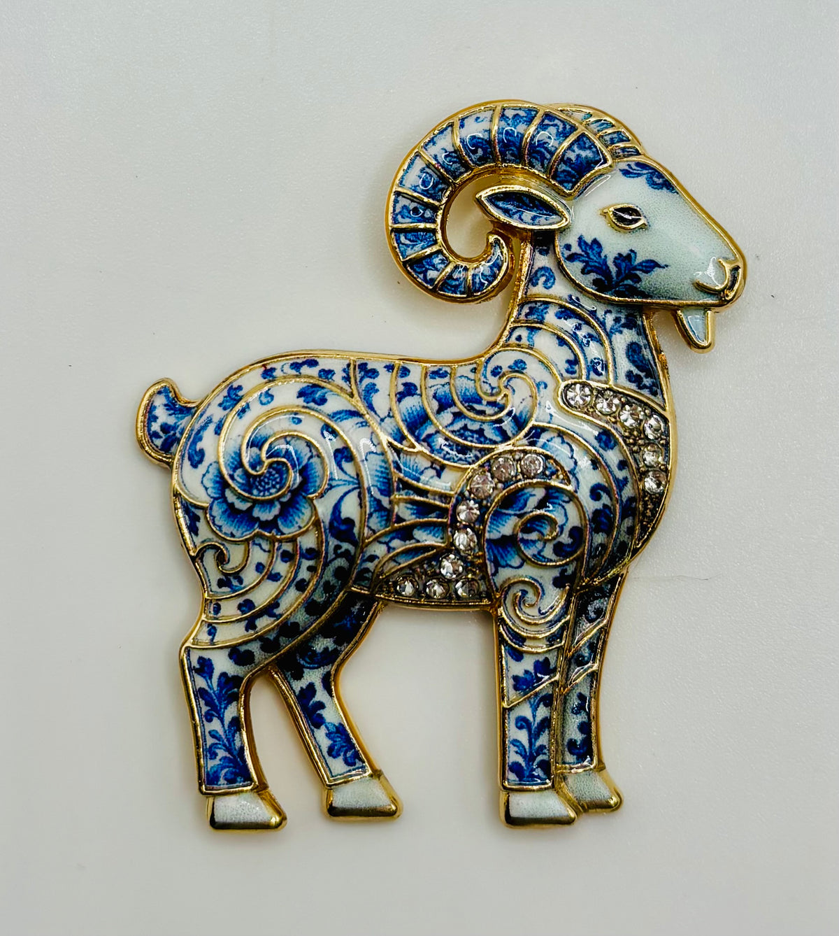 Blue white ram needle minder on white background