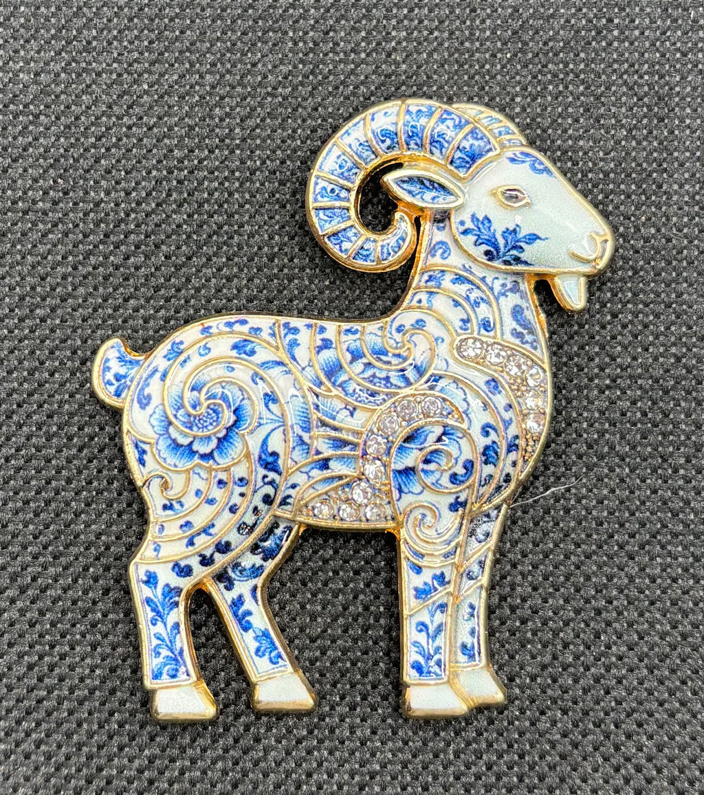 Blue white ram needle minder on dark fabric