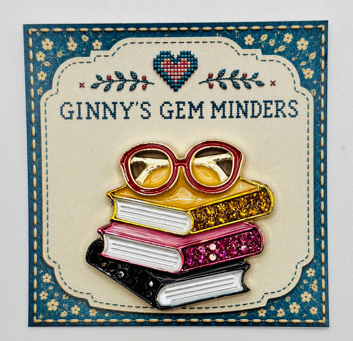 Enamel and Crystal Book Stack with Glasses Needle Minder — display card
