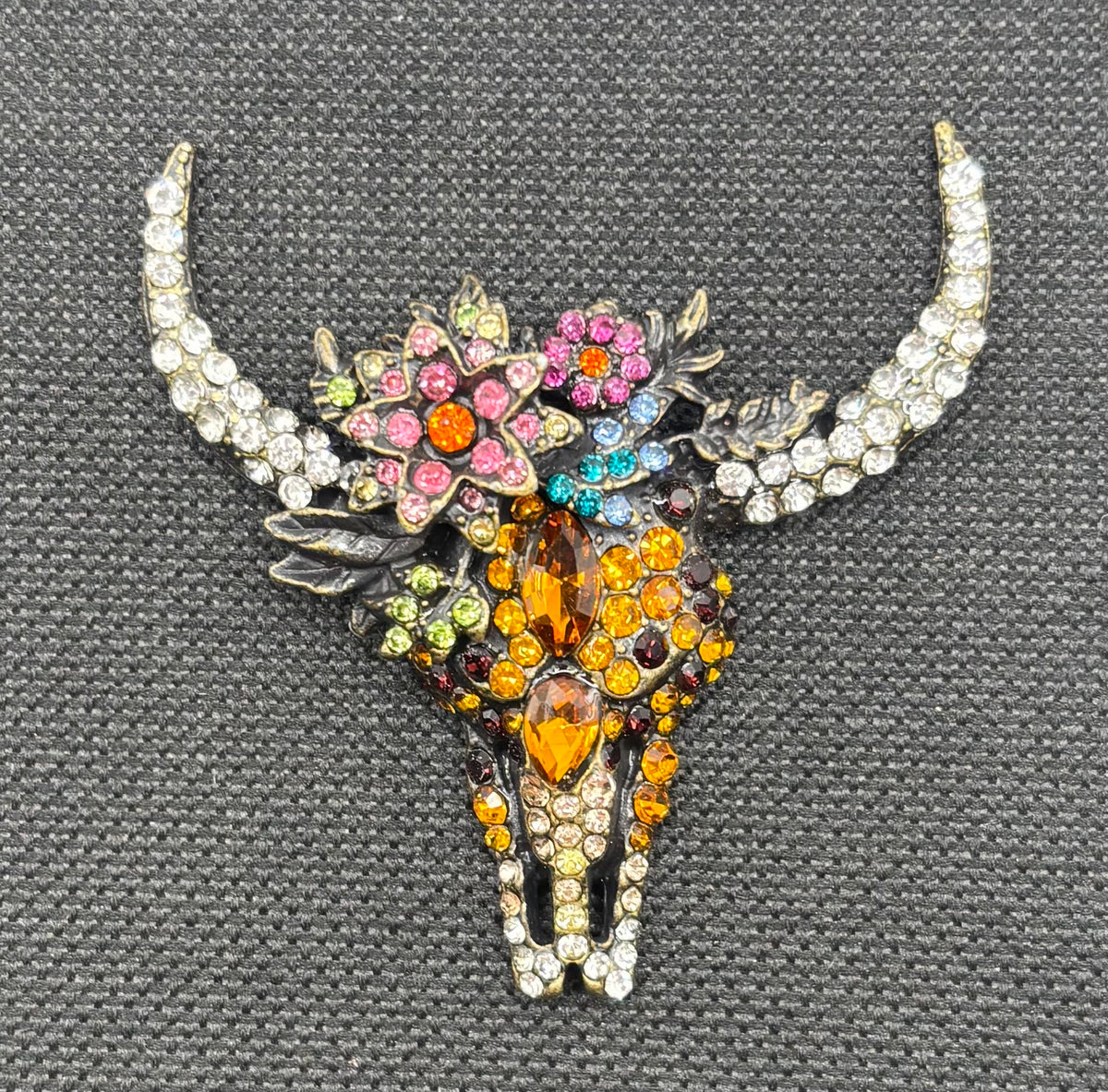 Stunning Crystal Cow Skull Needle Minder — dark fabric